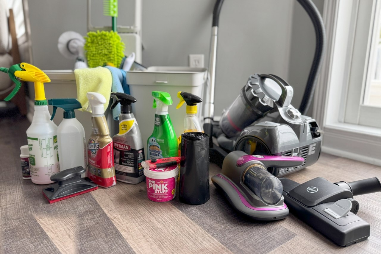 Professional cleaning supplies laid out on a living-room floor